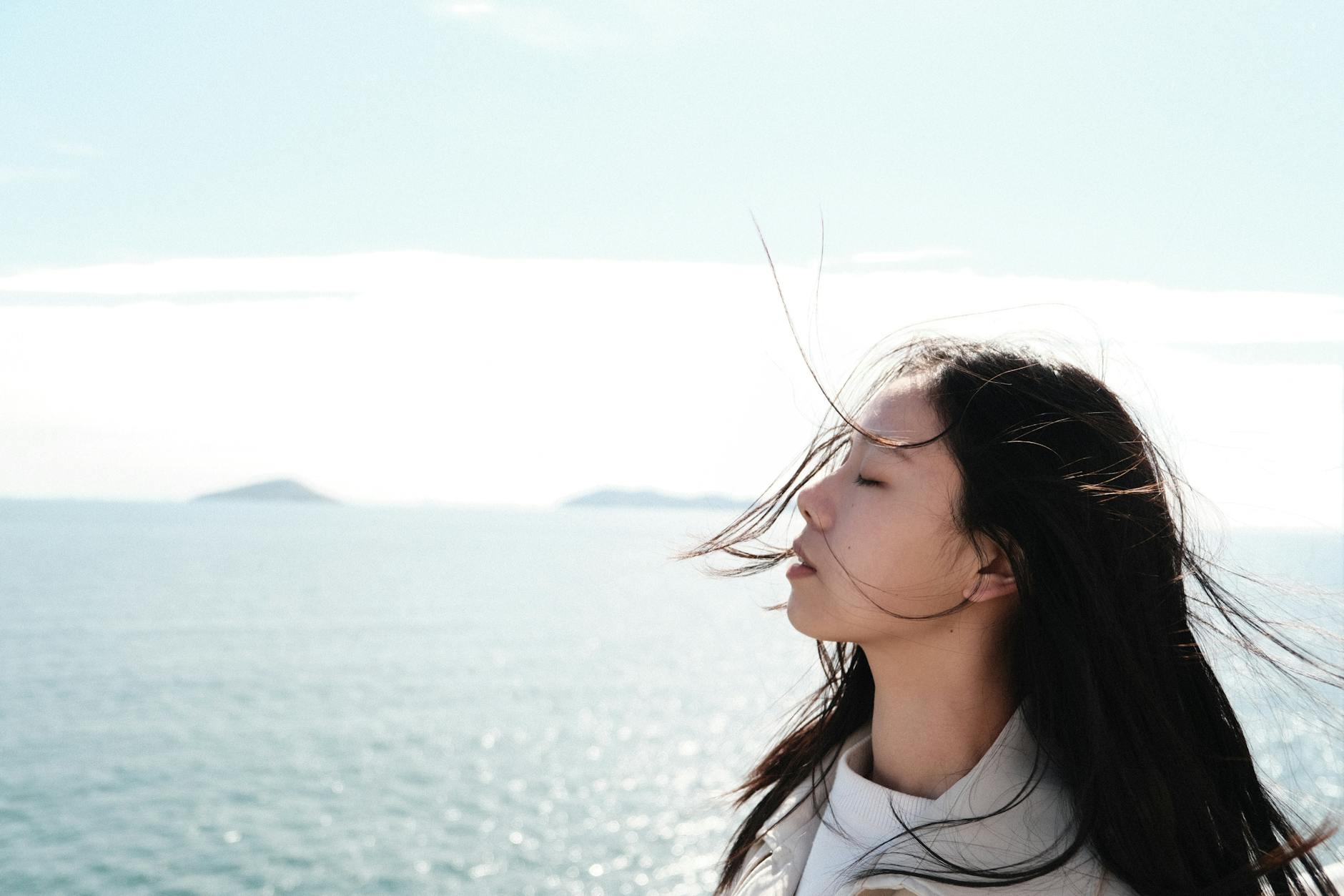 woman enjoying sea breeze